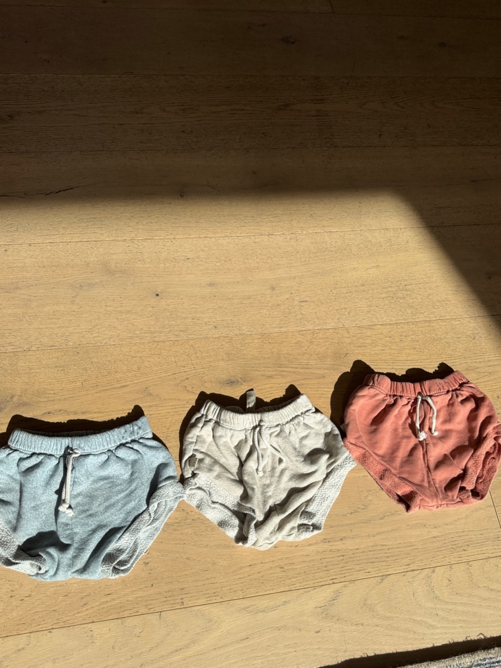 Childhood clothing shorties in Blue, Cream & Rust